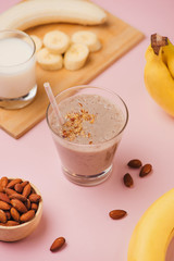 Fresh made Banana smoothie on pink background