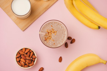 Fresh made Banana smoothie on pink background