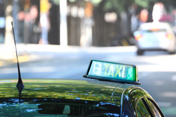 Typical taxi car in Barcelona. Public transportation service and empty copy space for Editor's text.