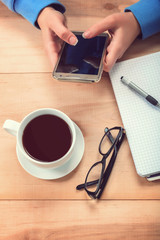 Girl with a mobile phone and stationery.