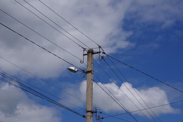 telegraph pole against the blue sky