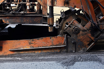Industrial heavy machine workink on road construction.