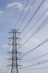 Hight Voltage Pole and The Blue Sky with Clouds.