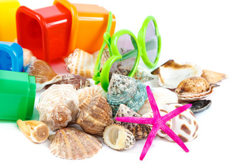 Flip-flops, molds for playing in the sand, sea shells, sun glasses, binoculars
