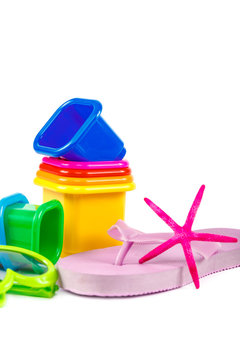 Flip-flops, molds for playing in the sand, sea shells, sun glasses, binoculars