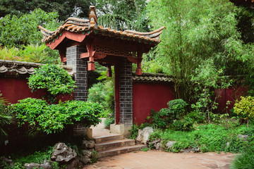 Traditional Chinese style gate and a wall in a park