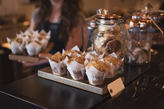 Close up of muffins and cookies at counter