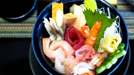 Asian food served on black stone, top view. Chinese and vietnamese cuisine set.