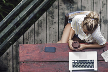 A Woman Freelancer Working on a Vacation