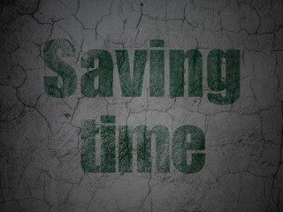 Time concept: Green Saving Time on grunge textured concrete wall background