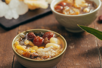 Well known and refresh asian dessert serves with longan, lotus foots, seaweed, fungus and jujube in the syrup can be found easily by the street in Chinatown.