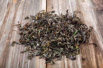 Medicinal herb on a wooden boards. Alternative