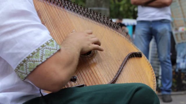 Musician plays the bandura on the street