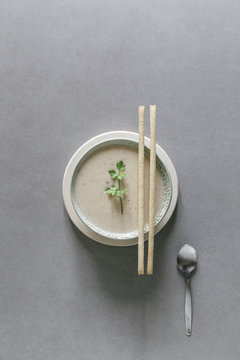 Tom ka Thai soup with fresh cilantro and bread sticks.