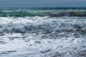 Abstract background of a boiling sea wave in a storm on a sky background