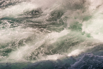 Abstract dramatic background of bubbling waves in a storm