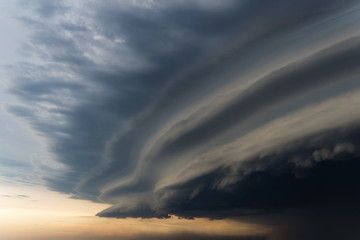 Dramatic rainy sky and dark clouds. Hurricane wind. Strong hurricane over the city. The sky is...