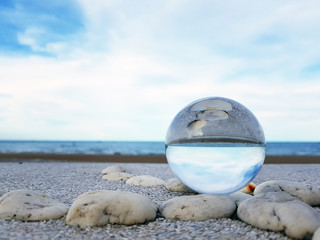 Fototapeta na wymiar Seascape in glass sphere