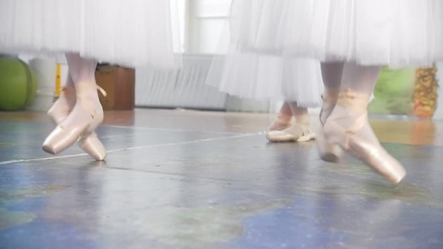 Ballet dance in studio - shoes on wooman's feet - slow-motion