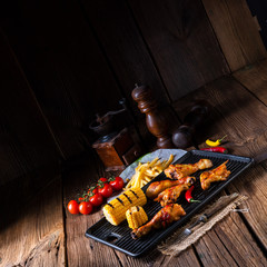 Rustic Grilled chicken wings,legs,and spicy corn