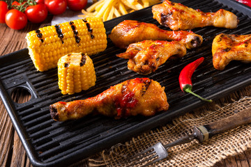 Rustic Grilled chicken wings,legs,and spicy corn