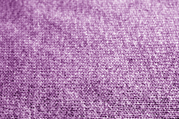Knitting pattern with blur effect in purple color.