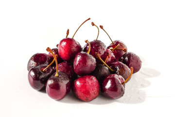 Fresh ripe cherries on white background