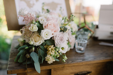 Decoration of a wedding with paper details and gentle fresh flowers