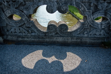 Shadow creates a sign of batman