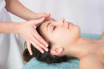 Obraz na płótnie Canvas Close-up of a young woman get spa treatment at beauty salon a spa face facial beauty treatment massage in salon