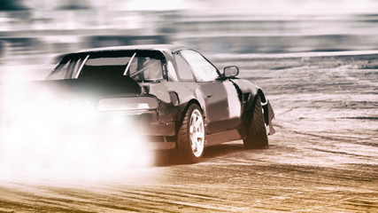 Dramatic car drifting, Blurred of image diffusion race drift car with lots of smoke from burning tires on speed track © applezoomzoom