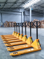 Yellow Hand Pallet Trucks In Warehouse