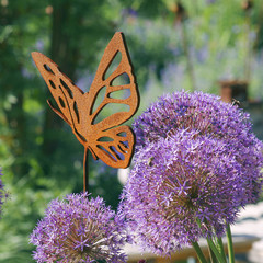 Iron decoration on a flower bed © 7monarda