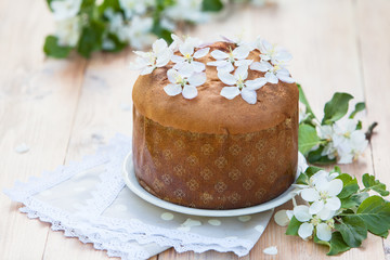  traditional italian pannetone cake decorated with flowers of apple tree