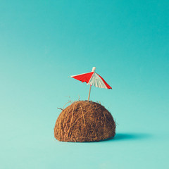 Tropical beach concept made of coconut fruit and sun umbrella. Creative minimal summer idea. - 210831753