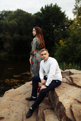 Couple in love celebrating anniversary on the rock
