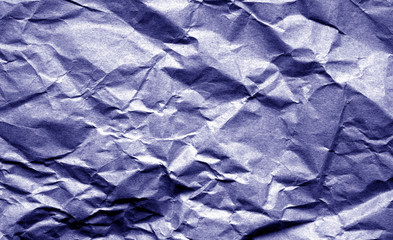 Old crumpled paper with wrinckles in blue color.