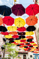Fototapeta na wymiar Lot of Umbrellas in Petit Champlain street Quebec city, Canada