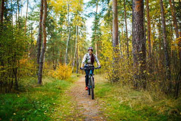 Photo of girl in helmet riding on bike