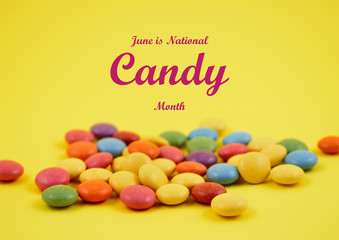 National candy month illustration. Colorful lentils stock images. Colorful candies on a yellow background. Chocolate lentils snack. Important day