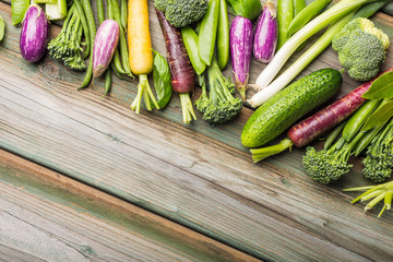 Healthy food concept background. Fresh raw vegetables on old wooden table. Top view and flat lay with copy space.