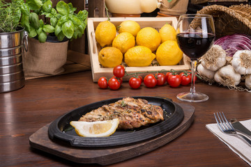Leg of roasted chicken on italian table