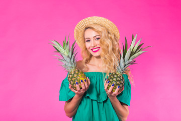 Portrait of happy woman and pineapple over pink background. Summer, diet and healthy lifestyle concept
