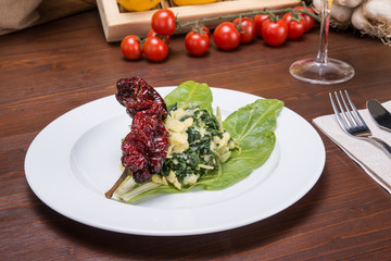 Leaves and potatoes on italian table