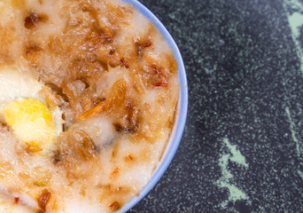 Taiwan's distinctive famous snacks: Savory rice pudding (Wa gui) in a white bowl on stone table, Taiwan Delicacies, Taiwan Street Food