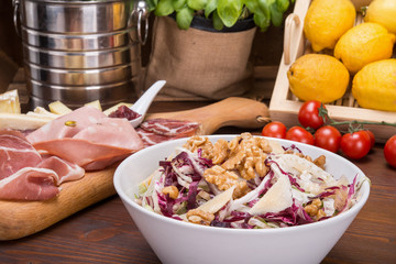 Salad with fennel, parmesan slices and walnuts