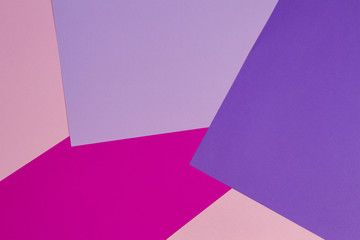 Color papers geometry flat composition background with violet, purple, pink, rose tones.
