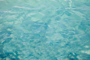 Blue sea ocean water background .Tropical Pattern blue ripple curl water in swimming pool .