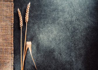 ears of wheat on wood
