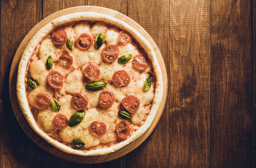 pizza at wooden table